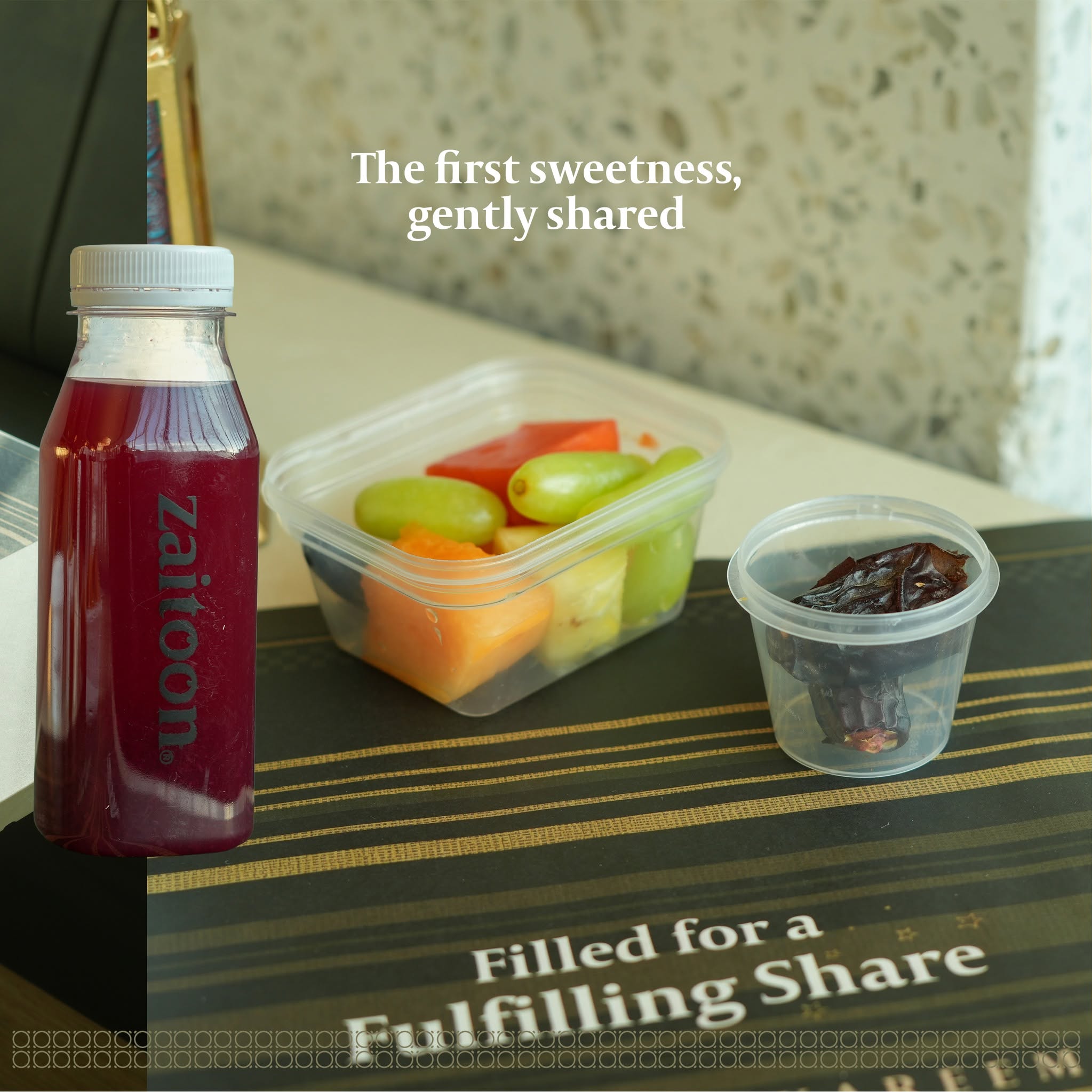 Iftar box with dates, fruits, kanji, BBQ chicken and pomegranate cooler